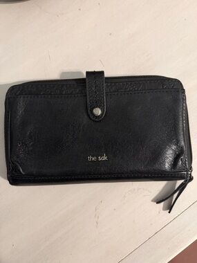 The Sak Black Leather Zip Wallet with Snap Tab